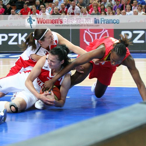  Polish players stopping Sancho Lyttle from getting the ball at EuroBasket 2011 © womensbasketball-in-france.com  